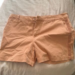 Gently used coral colored shorts with side and back pockets.